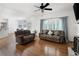 Spacious living room with hardwood floors, neutral colors, and comfortable seating arrangement at 672 Red Sunset Cir, Powder Springs, GA 30127