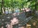 Picnic area with a stone bench and river views, perfect for outdoor meals at 672 Red Sunset Cir, Powder Springs, GA 30127