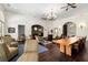 Large clubhouse with dark hardwood floors, high ceilings and seating areas at 11271 Calypso Dr, Alpharetta, GA 30009