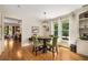 Comfortable dining area adjacent to kitchen with hardwood floors at 11271 Calypso Dr, Alpharetta, GA 30009