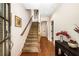 Warm and inviting entryway with hardwood floors and staircase at 11271 Calypso Dr, Alpharetta, GA 30009