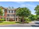Charming brick townhome featuring manicured landscaping and tree-lined street in a desirable neighborhood at 11271 Calypso Dr, Alpharetta, GA 30009