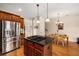 Updated kitchen showcases stainless appliances, a central island, and leads into a cozy breakfast area at 11271 Calypso Dr, Alpharetta, GA 30009