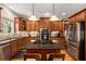 Charming kitchen with stainless steel appliances, granite counters, a central island, and plenty of natural light at 11271 Calypso Dr, Alpharetta, GA 30009