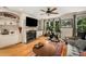 Bright living room with fireplace and hardwood floors at 11271 Calypso Dr, Alpharetta, GA 30009