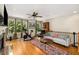 Open-concept living room with hardwood floors and ample natural light at 11271 Calypso Dr, Alpharetta, GA 30009