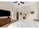 Spacious bedroom with a large TV, ensuite bathroom, and convenient access to other rooms at 11271 Calypso Dr, Alpharetta, GA 30009