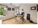 Home office space with a desk, chair, shelving, and a window providing natural light at 11271 Calypso Dr, Alpharetta, GA 30009