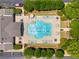 Aerial view of a sparkling blue community pool surrounded by lounge chairs at 11271 Calypso Dr, Alpharetta, GA 30009