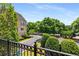 Street view from the house's balcony features green trees and manicured landscaping at 11271 Calypso Dr, Alpharetta, GA 30009