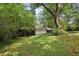 Large backyard with mature trees and shrubs at 1194 Robert Ln, Marietta, GA 30062