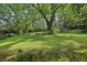 Expansive green lawn dotted with mature trees at 1194 Robert Ln, Marietta, GA 30062
