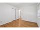 Neutral bedroom with hardwood floors, closet, and window at 1194 Robert Ln, Marietta, GA 30062