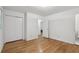 Bedroom features hardwood floors, closet, window, and ensuite bath at 1194 Robert Ln, Marietta, GA 30062