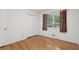 Bedroom with hardwood floors, closet, and a window with curtains at 1194 Robert Ln, Marietta, GA 30062