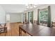 Dining area featuring hardwood floors, a chandelier, and natural light from the adjacent windows at 1194 Robert Ln, Marietta, GA 30062
