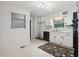 Functional kitchen featuring white cabinets, black appliances, and updated light fixtures at 1194 Robert Ln, Marietta, GA 30062