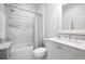 Elegant bathroom featuring marble countertops, tiled shower, and modern fixtures at 144 Northern Ave, Decatur, GA 30030