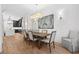 Dining area with wood table, chandelier, and views of kitchen at 144 Northern Ave, Decatur, GA 30030