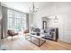 Bright living room featuring large windows, hardwood floors, and stylish contemporary furniture at 144 Northern Ave, Decatur, GA 30030