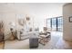 Inviting living room with panelled walls, neutral furniture, and ample natural light at 144 Northern Ave, Decatur, GA 30030
