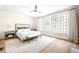 Bright main bedroom with hardwood floors, large windows, and neutral decor at 144 Northern Ave, Decatur, GA 30030