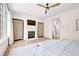 Serene main bedroom featuring a fireplace, built in cabinets, and a view of the ensuite bathroom at 144 Northern Ave, Decatur, GA 30030