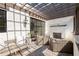 Covered outdoor living space with a fireplace and comfortable seating at 144 Northern Ave, Decatur, GA 30030