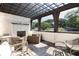 Comfortable outdoor living space with a pergola and brick fireplace at 144 Northern Ave, Decatur, GA 30030