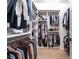 Spacious walk-in closet with custom shelving, hanging rods, and wood floor offers ample storage at 144 Northern Ave, Decatur, GA 30030