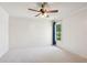 Spacious bedroom with a ceiling fan and window, ready for customization at 558 Grand Ivey Pl, Dacula, GA 30019