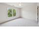Bright bedroom features a large window, neutral carpeting and trim and plenty of natural light at 558 Grand Ivey Pl, Dacula, GA 30019
