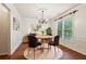 Elegant dining room featuring modern chandelier, and natural light at 558 Grand Ivey Pl, Dacula, GA 30019