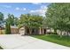 Attractive home with a long driveway leading to a two-car garage, complemented by lush greenery at 558 Grand Ivey Pl, Dacula, GA 30019