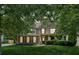 Beautiful two-story home featuring a well-maintained lawn, inviting front porch, and tasteful landscaping at 558 Grand Ivey Pl, Dacula, GA 30019