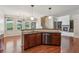 Spacious open-concept kitchen with a breakfast bar, perfect for entertaining, and stainless appliances at 558 Grand Ivey Pl, Dacula, GA 30019