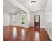 Spacious living room with hardwood floors and plenty of natural light at 558 Grand Ivey Pl, Dacula, GA 30019