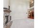 Open concept living room featuring a stone fireplace and views of the second story at 558 Grand Ivey Pl, Dacula, GA 30019