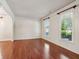 Bright living room featuring wood floors and natural light at 558 Grand Ivey Pl, Dacula, GA 30019