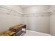 Walk-in closet with a wood table and shelves to maximize your space at 558 Grand Ivey Pl, Dacula, GA 30019