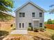 The backyard features a patio, lush greenery, and a well-maintained lawn at 2470 Arnold Mill Rd, Lawrenceville, GA 30044