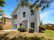 The backyard features a patio, lush greenery, and a well-maintained lawn at 2470 Arnold Mill Rd, Lawrenceville, GA 30044