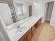 Primary bath features dual sinks, a vanity, and a large mirror at 2470 Arnold Mill Rd, Lawrenceville, GA 30044