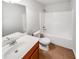 Bathroom featuring a sink, toilet, mirror, and tub at 2470 Arnold Mill Rd, Lawrenceville, GA 30044
