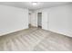 This bedroom has a walk-in closet and neutral carpet at 2470 Arnold Mill Rd, Lawrenceville, GA 30044