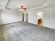 Spacious bedroom features a tray ceiling and neutral carpet at 2470 Arnold Mill Rd, Lawrenceville, GA 30044