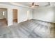 This bedroom offers a walk-in closet, neutral carpet, and an open floor plan at 2470 Arnold Mill Rd, Lawrenceville, GA 30044