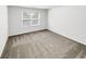 Cozy bedroom with neutral carpet, one window, and white walls at 2470 Arnold Mill Rd, Lawrenceville, GA 30044