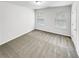 Bright bedroom with neutral walls and carpeting features natural light from two windows at 2470 Arnold Mill Rd, Lawrenceville, GA 30044
