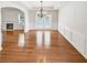Elegant dining room with hardwood floors, chandelier, and access to the living room at 2470 Arnold Mill Rd, Lawrenceville, GA 30044